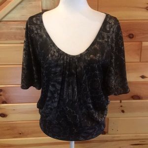 Scoop neck top. Black, brown and white colors.